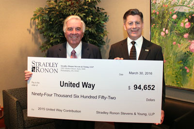 Bill Sasso and Jim Cawley with check to United Way